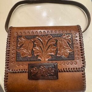Brown Leather Shoulder Bag with Intricate Design